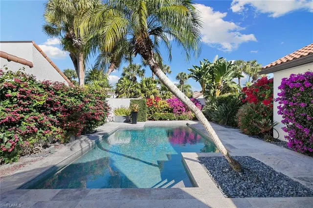 a view of a swimming pool with a patio