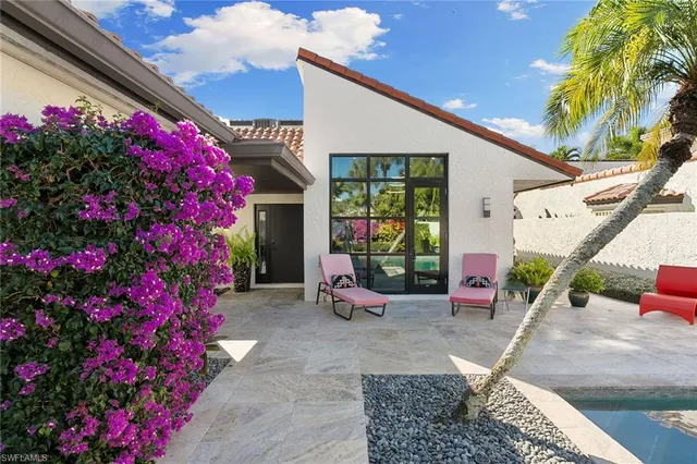 an aerial view of a house with a mountain view