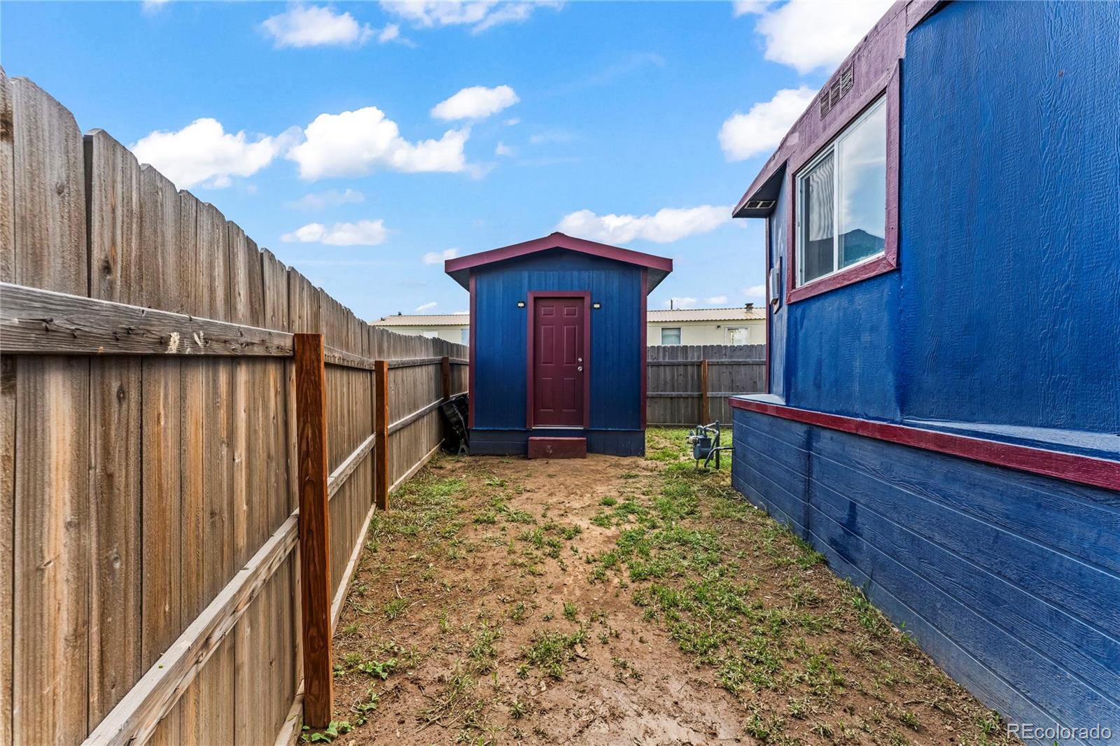 75 North Curtis Road Colorado Springs, CO 80930 - Photo 18 of 19 a view of balcony with wooden floor and fence