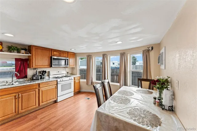 a kitchen with a sink stove and microwave