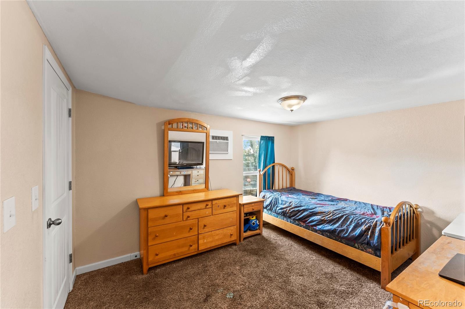 75 North Curtis Road Colorado Springs, CO 80930 - Photo 10 of 19 a bedroom with furniture and window