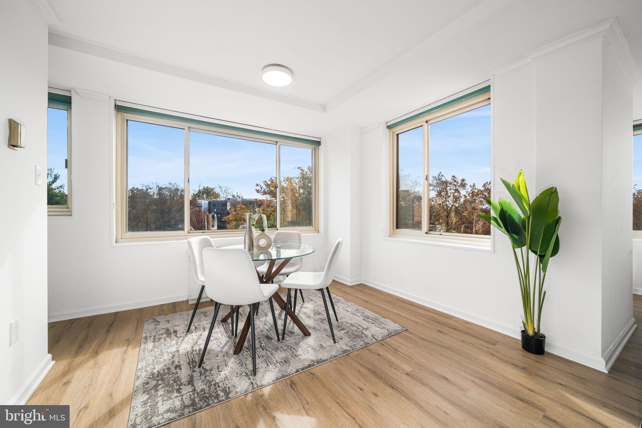 4000 Tunlaw Road Northwest, Unit 811 Washington, DC 20007 - Photo 16 of 51 a dining room with furniture and window