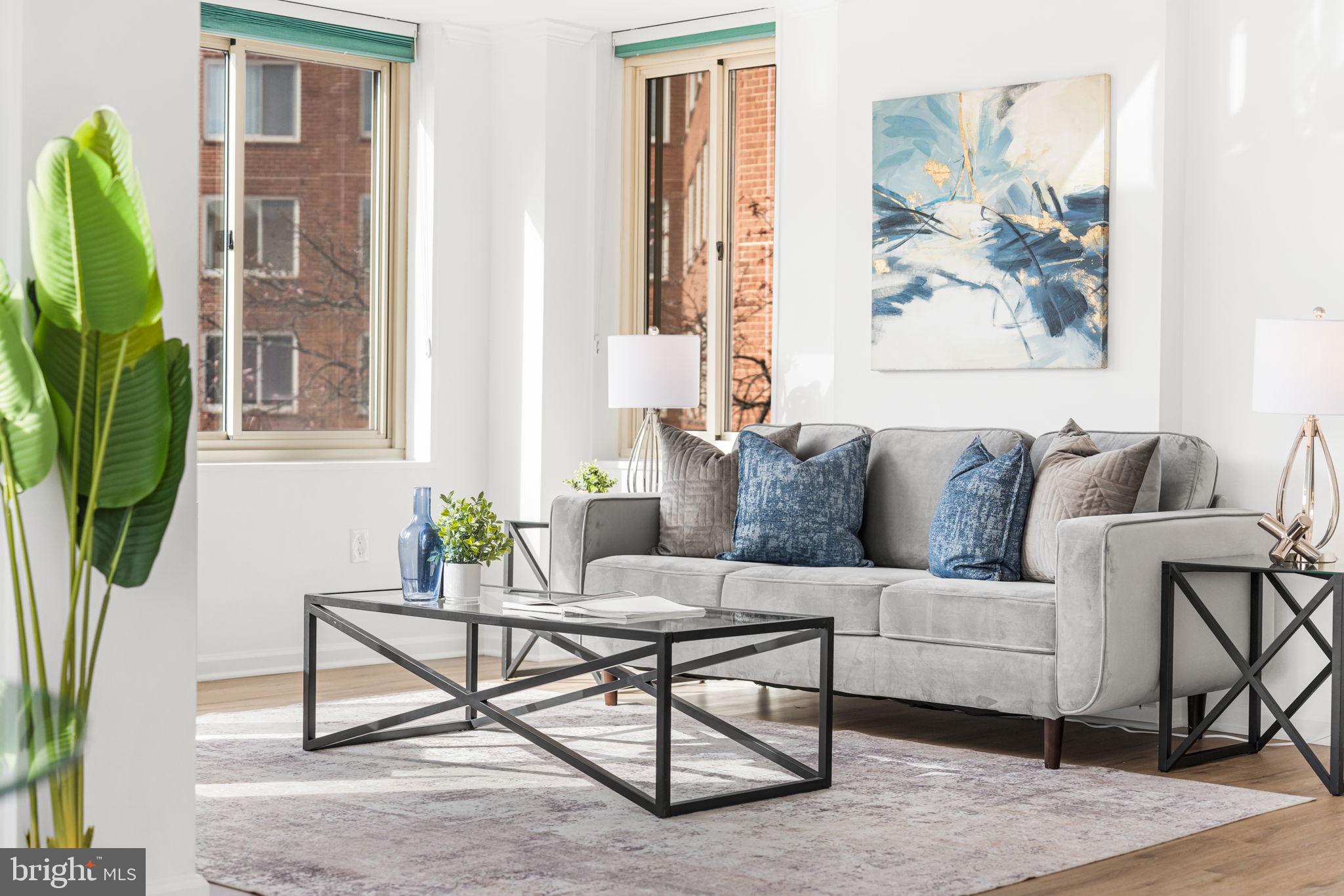 4000 Tunlaw Road Northwest, Unit 811 Washington, DC 20007 - Photo 6 of 51 a living room with furniture and a potted plant