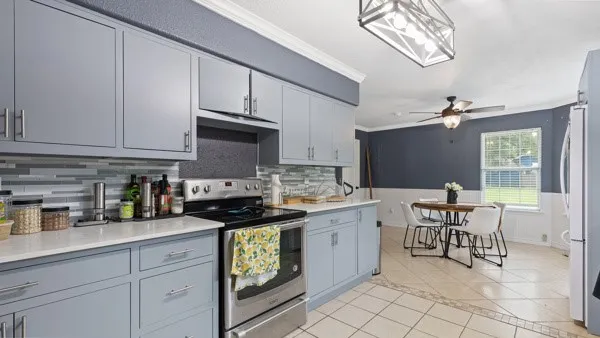 a kitchen with granite countertop a sink and cabinets