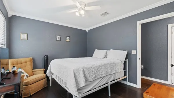 a bedroom with a bed and a couch