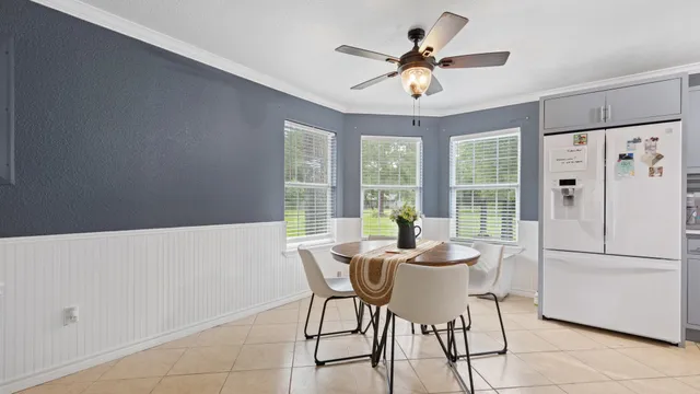 a dining room with furniture and window