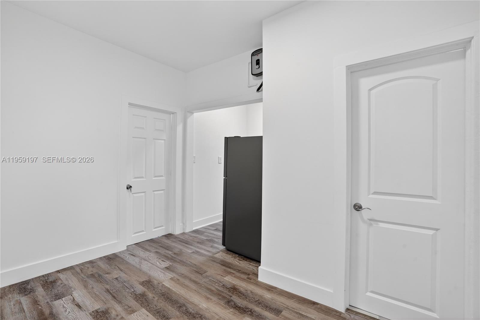 1630 Southwest 10th Street Miami, FL 33135 - Photo 8 of 20 an empty room with wooden floor