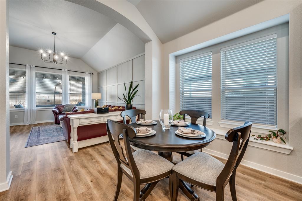 3513 Dusty Miller Road Aubrey, TX 76227 - Photo 13 of 25 a view of a dining room with furniture and wooden floor