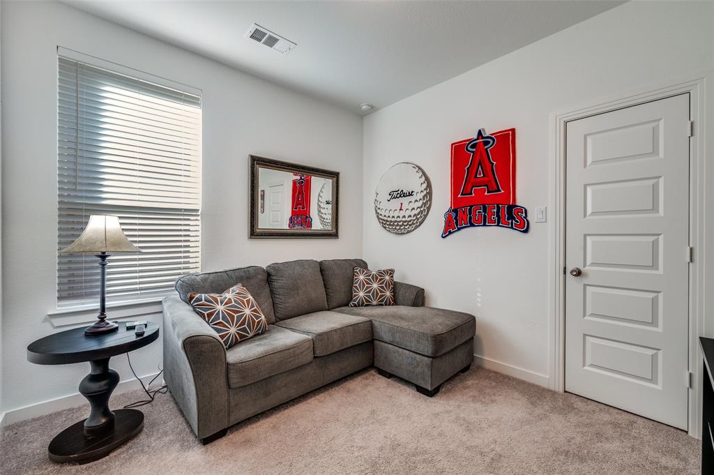 3513 Dusty Miller Road Aubrey, TX 76227 - Photo 14 of 25 a living room with furniture and a window