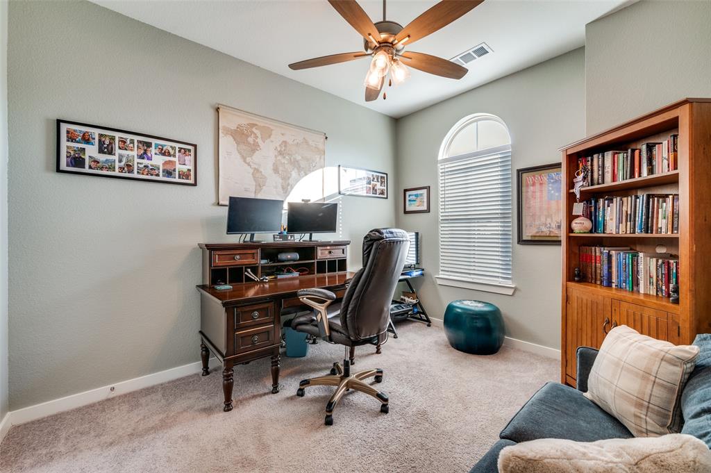 3513 Dusty Miller Road Aubrey, TX 76227 - Photo 15 of 25 a view of a livingroom with workspace and a couch