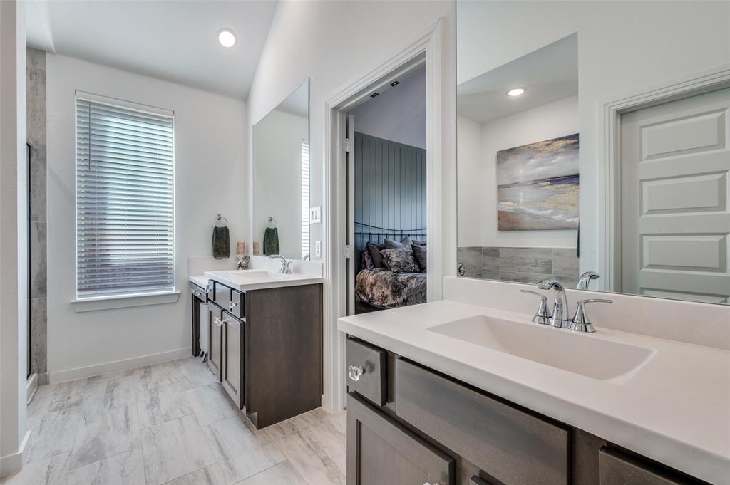 3513 Dusty Miller Road Aubrey, TX 76227 - Photo 20 of 25 a bathroom with a sink double vanity and a mirror