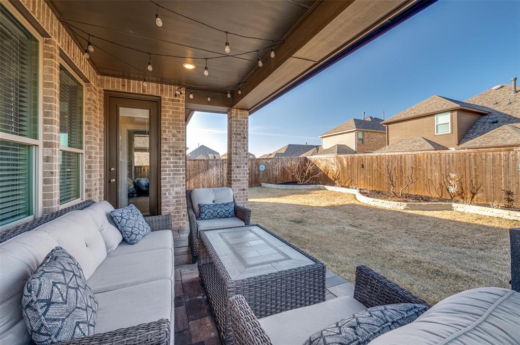 3513 Dusty Miller Road Aubrey, TX 76227 - Photo 21 of 25 a living room with furniture and a rug