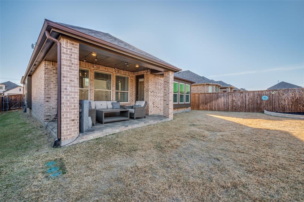 3513 Dusty Miller Road Aubrey, TX 76227 - Photo 22 of 25 a view of backyard with furniture and a yard