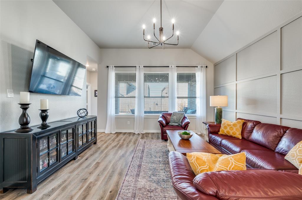 3513 Dusty Miller Road Aubrey, TX 76227 - Photo 4 of 25 a living room with furniture and a flat screen tv
