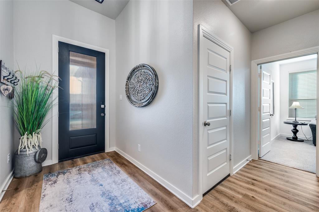 3513 Dusty Miller Road Aubrey, TX 76227 - Photo 7 of 25 a view of a hallway with interior of the house