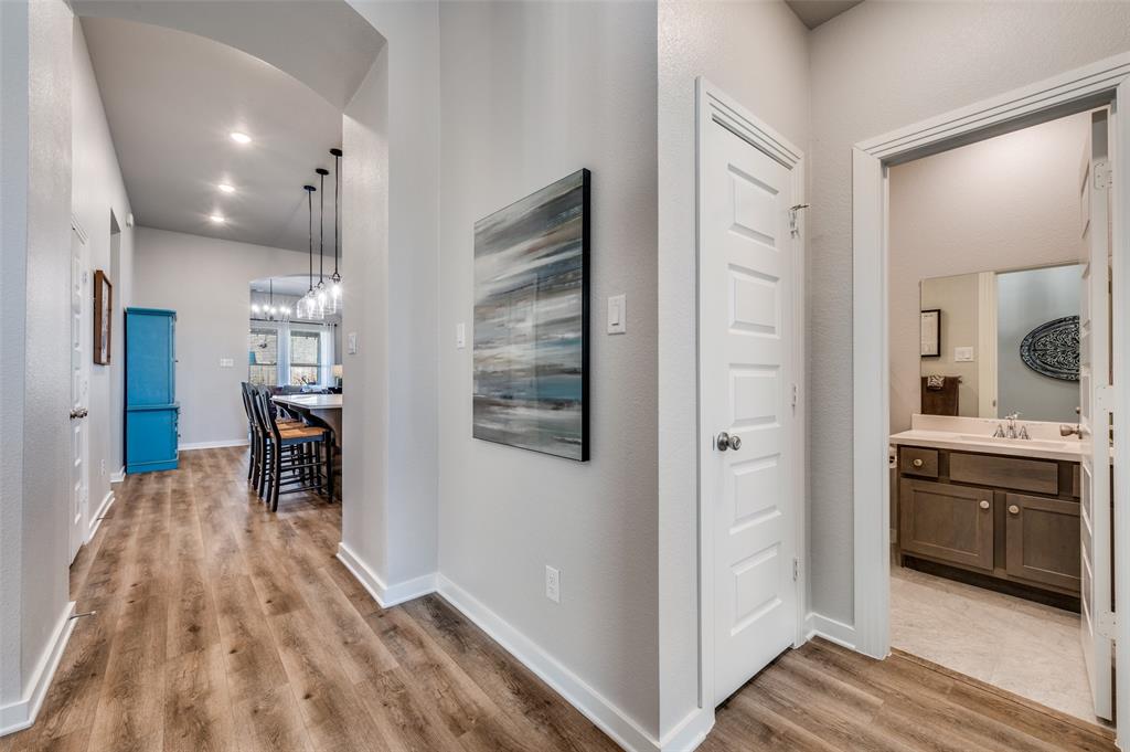3513 Dusty Miller Road Aubrey, TX 76227 - Photo 8 of 25 a kitchen with stainless steel appliances granite countertop a refrigerator and a sink