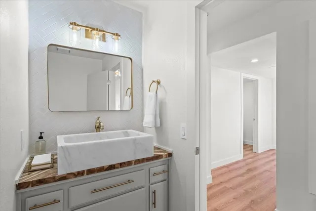 a bathroom with a sink and a mirror