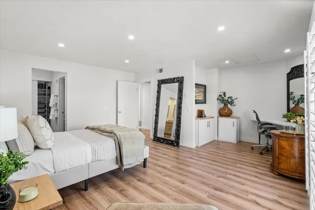 a bed room with a bed and a television