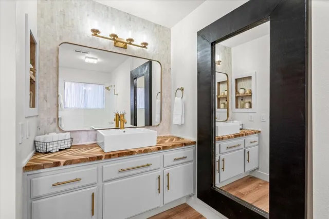 a bathroom with a sink and a mirror