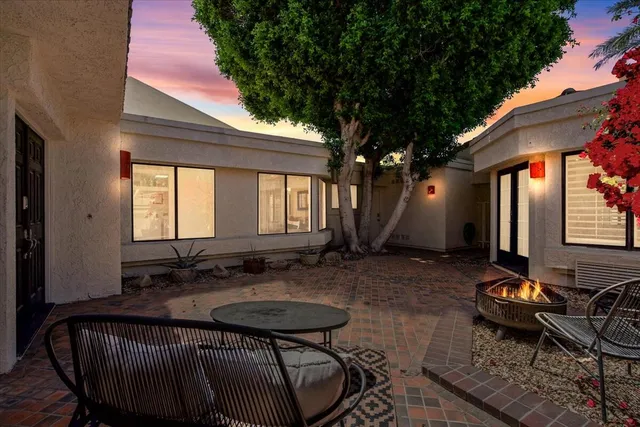 a backyard of a house with seating space