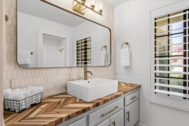 a bathroom with a sink and a mirror