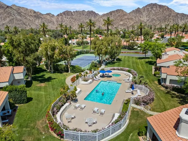 an aerial view of a house with outdoor space swimming pool