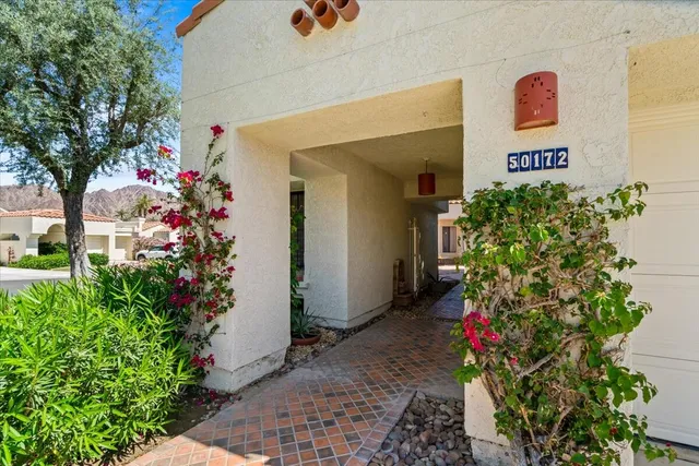 a bunch of flowers in front of a building