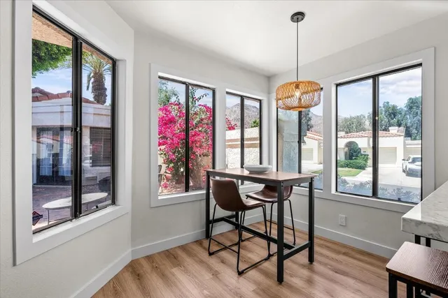 a dining room with furniture window wooden floor