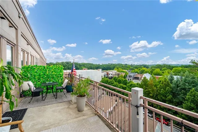 a view of a balcony with chairs