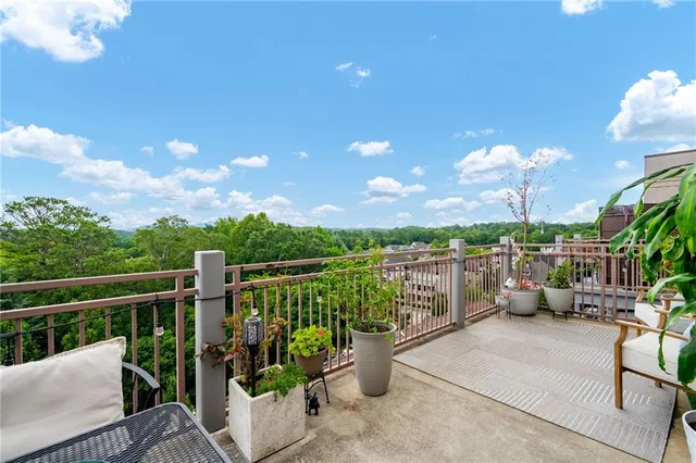a view of a balcony with couches