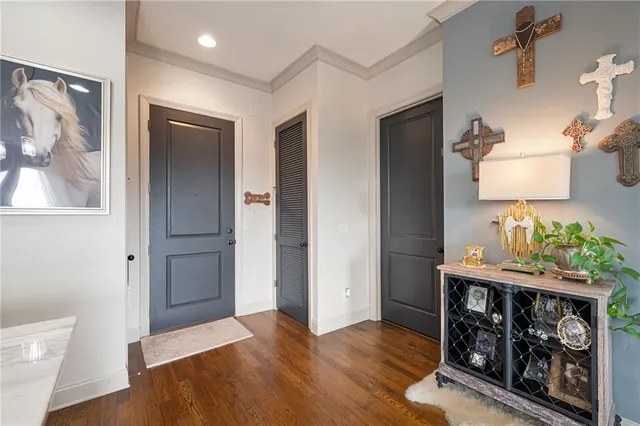 a view of an entryway with wooden floor