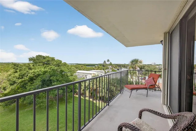 a view of a balcony with chair