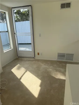 a view of an empty room and window