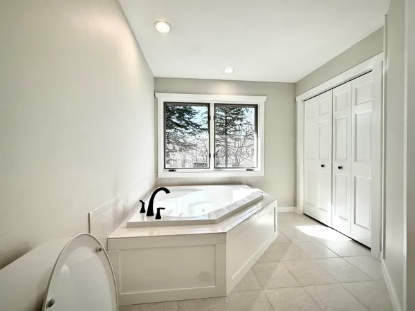 a living room with a sink and a window