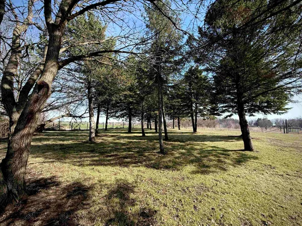 a view of a lake next to a yard