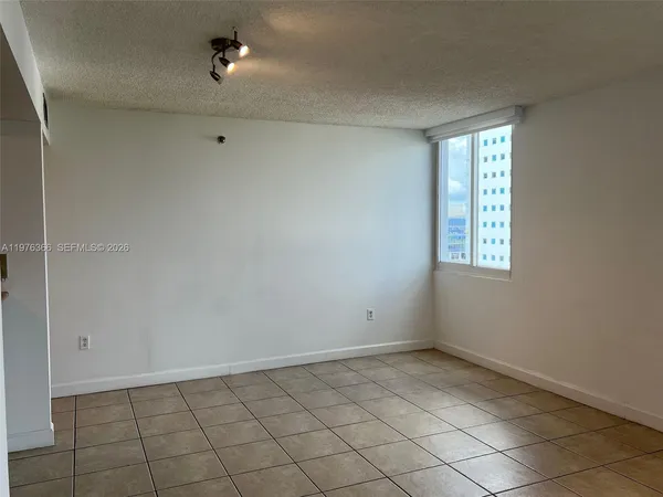 a kitchen with a refrigerator and a sink