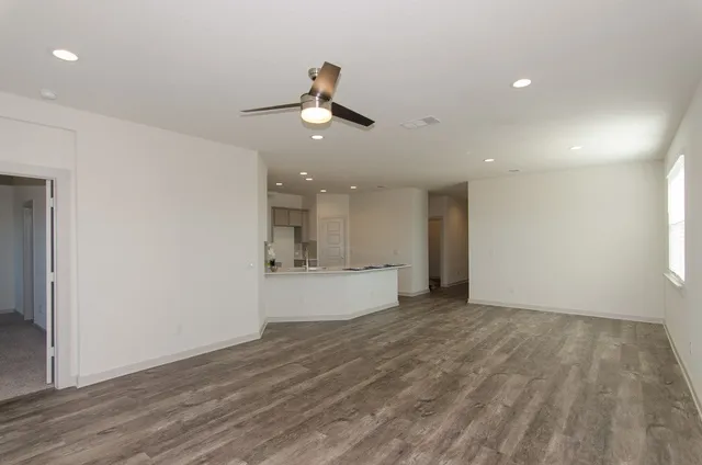 a view of a kitchen with a sink and a window