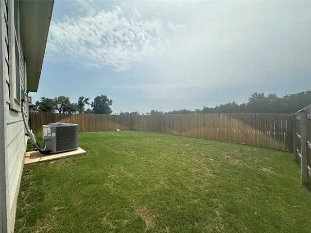 a view of a lake with a big yard