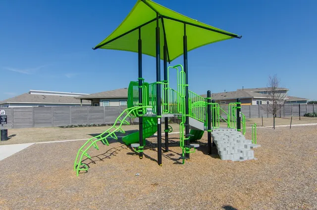 an outdoor space with furniture and umbrella