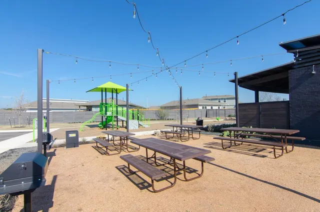 a view of a swimming pool with outdoor seating