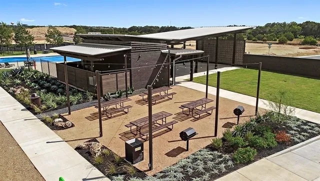 a view of a backyard with sitting area