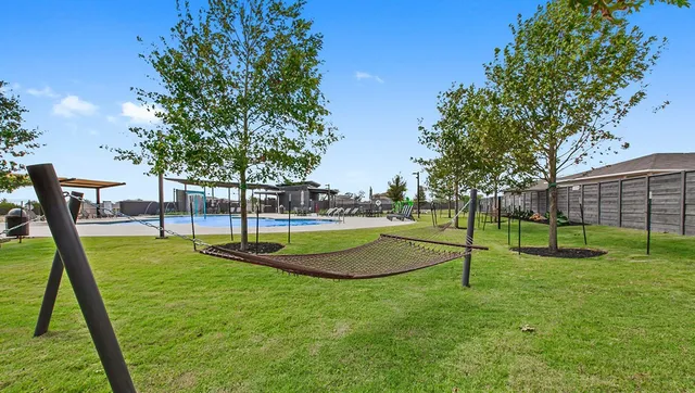 a view of a backyard with swings