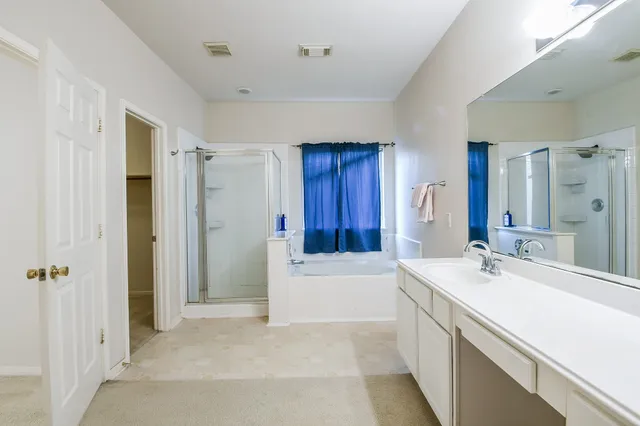 a bathroom with a sink a mirror and a bathtub