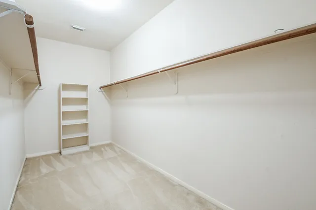 a view of an empty walk in closet