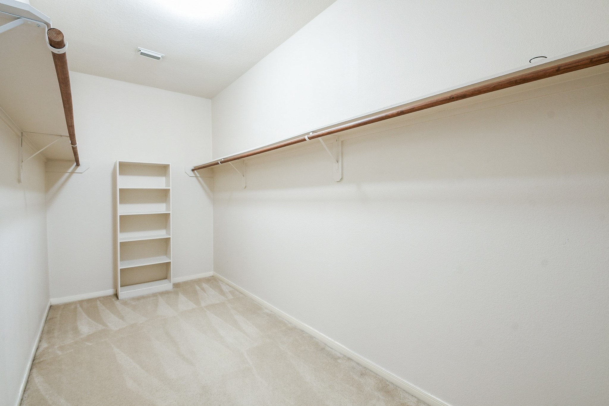 24219 Camillia Ridge Way Katy, TX 77493 - Photo 18 of 32 a view of an empty walk in closet