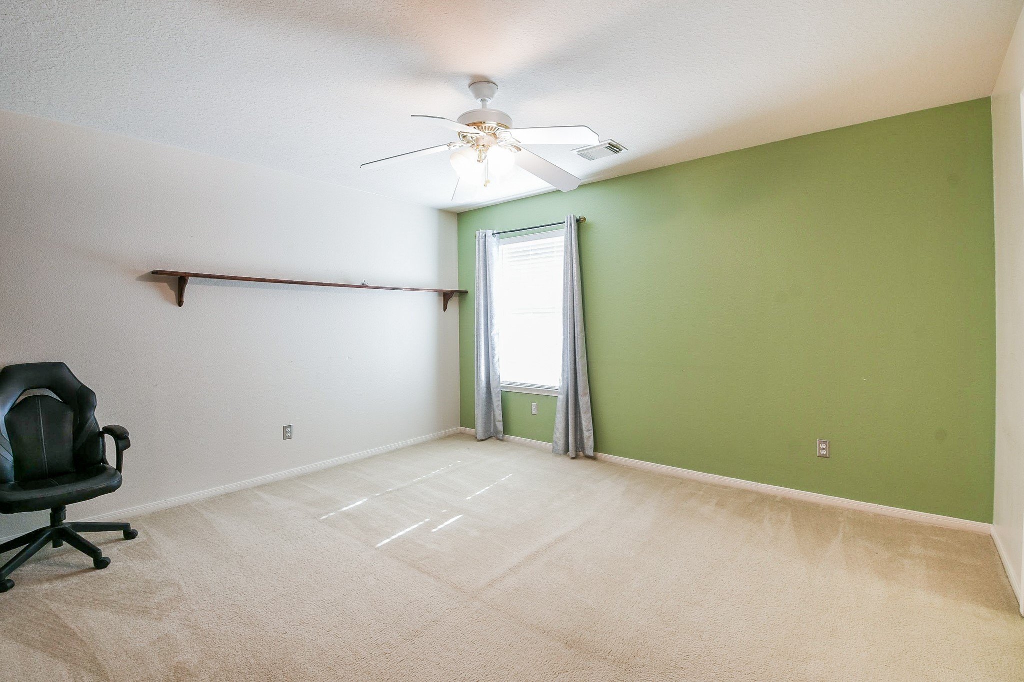 24219 Camillia Ridge Way Katy, TX 77493 - Photo 22 of 32 a view of an empty room with a window