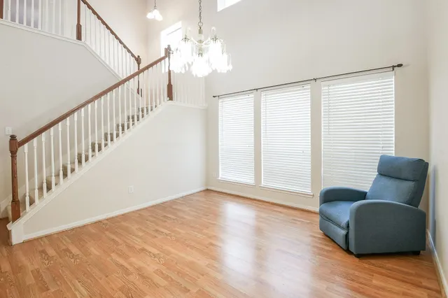 a view of livingroom with furniture wooden floor and windows