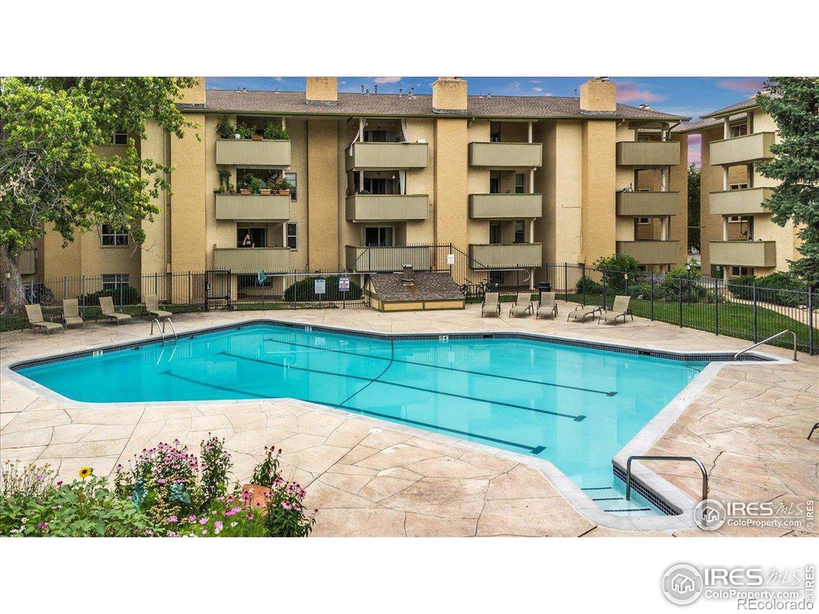 3035 Oneal Parkway, Unit T11 Boulder, CO 80301 - Photo 16 of 28 a swimming pool with outdoor seating and yard