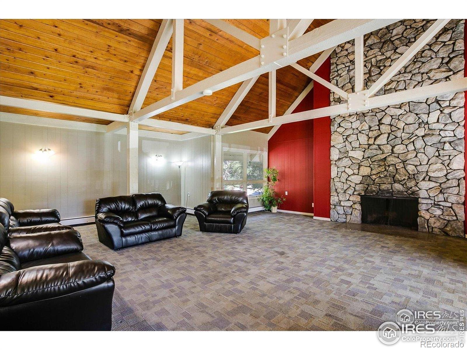 3035 Oneal Parkway, Unit T11 Boulder, CO 80301 - Photo 17 of 28 a room with furniture and a fireplace