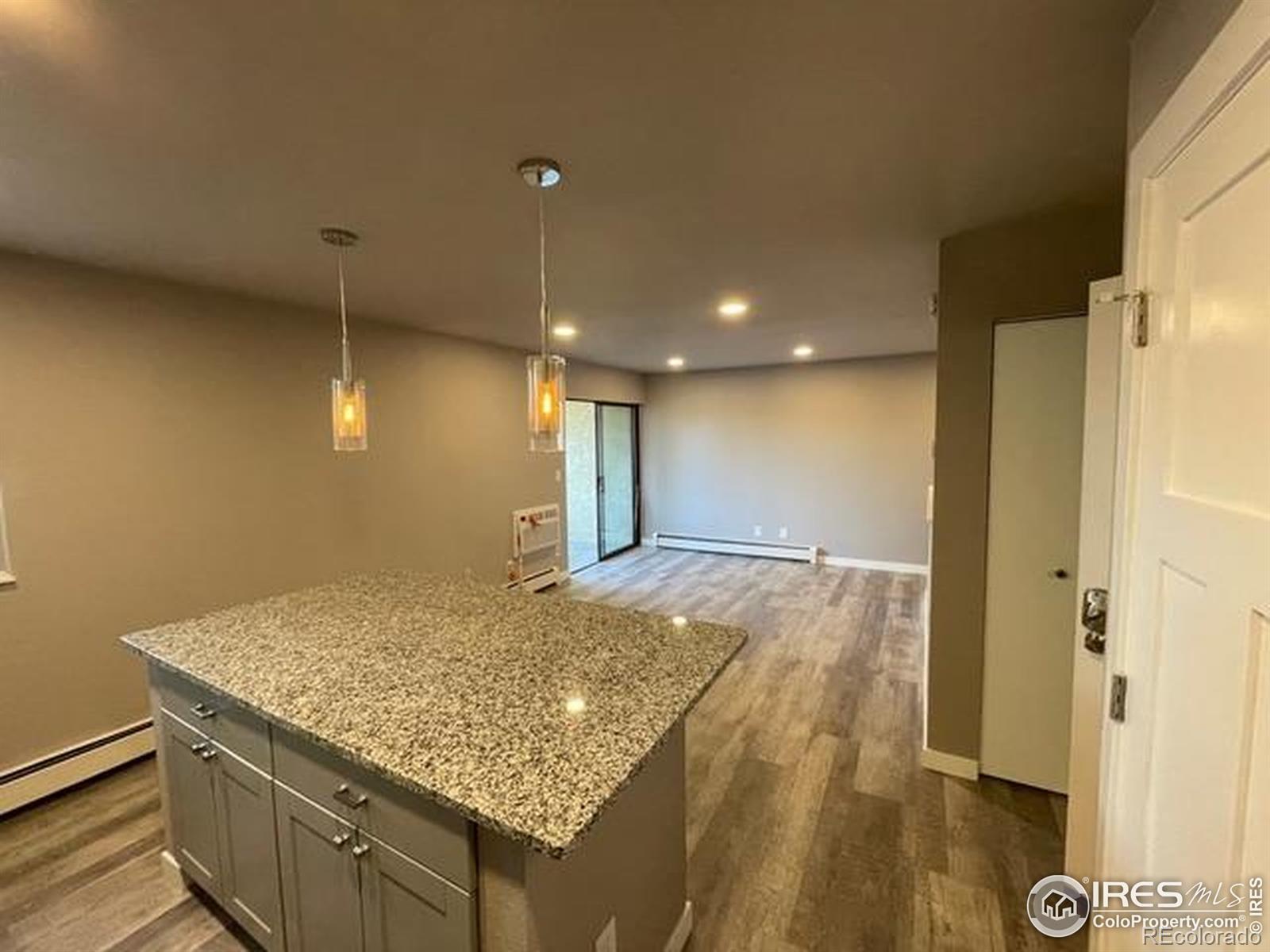 3035 Oneal Parkway, Unit T11 Boulder, CO 80301 - Photo 5 of 28 a bathroom with a granite countertop sink and a shower